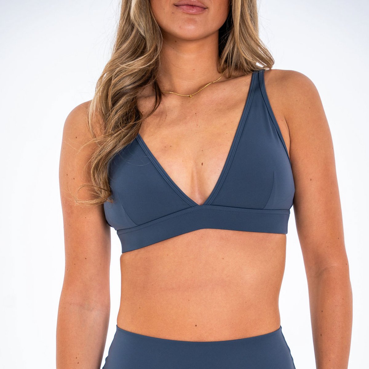 Image of Sculpt Plunge Sports Bra - Color - Steel Blue - Silver Logo